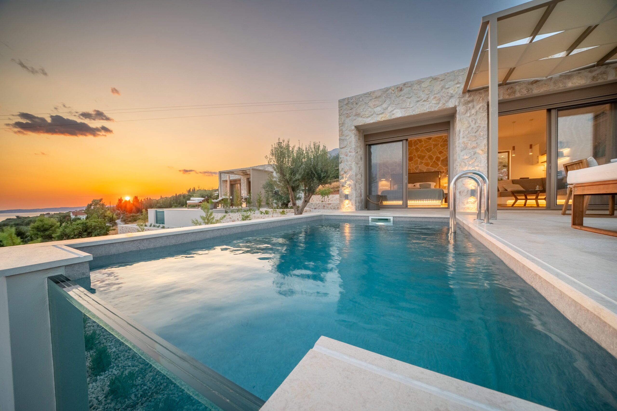 Infinity pool sunset with sea view